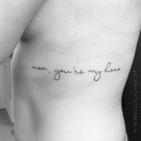 small tattoos on Instagram: ““mom, you’re my hero”  Tattoo artist: @eternitytattooberlin” Quotes For Mom Tattoo, Strong Mom Tattoo Ideas, Tattoo Ideas Dedicated To Mom, Tato Mom, My Hero Tattoo, My Mom Tattoo, Grandpa Tattoos, Tattoos Dedicated To Mom, Tattoos To Honor Mom