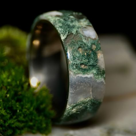 This beautiful ring is made from a solid specimen of Indian Moss Agate. Agate is the banded variety of Chalcedony. This particular agate, Indian Moss Agate, includes beautiful, detailed moss-like filaments among clear sections called "windows." Indian Moss Agate is a mineral with a Mohs hardness of 6.5-7 (For reference, gold has a Mohs hardness of 2.5-3). Agates are found all over the world, but this specific variety is found primarily in Gujarat, India. This is the only lined solid Indian Moss Agate ring you will find on the internet! Pictured: Flat, 8mm, Titanium, Size 9 *Sizing Information:* If you know your ring size, we will send you a sizer within 2-3 sizes of your size. If you do not know your ring size, we will send a ring sizer that includes all of our sizes. This allows us to get Men Gemstone Ring Design, Unique Mens Engagement Rings, Moss Agate Engagement Ring Men, Moss Agate Ring For Men, Mens Gemstone Rings Unique, Mens Engagement Rings Moss Agate, Moss Agate Mens Wedding Band, Men’s Wedding Rings Moss Agate, Ring Moss Agate