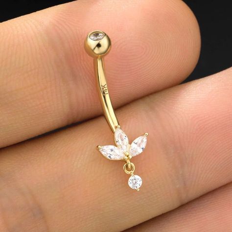 14K Solid Gold 14G flower Shape Belly Button Ring,Moissanite Diamond Lotus Belly Button Ring ,Curved Barbell,Navel Piercing Jewelry This elegant solid gold navel barbell features our largest invisible set lotus design, with no visible bezels or prongs, creating a floating effect on the skin. A delicate dangle adds a touch of movement and sophistication to the top of the navel, making this piece a perfect blend of elegance and modern style. --- IᑎᖴOᖇᗰᗩTIOᑎ ᗩᗷOᑌT ᑭᖇOᗪᑌᑕT --- ❖ Metal Type: 14K,18K Solid Gold ❖ Diamond Type: Moissanite ❖ Diamond Shape: Round Cut Diamond and Fancy Cut Diamond ❖ Diamond Size; 6mm or 9mm ❖ Diamond Color: G-H ❖ Diamond Clarity: VS ❖ Length: 5mm, 6.5mm, 8.00mm, 9.5mm, 11.00mm ❖ SKU: OSTJ257 "The size may differ depending on measurement methods." "The colour display Dangling Belly Button Piercing, Flower Belly Ring, Dainty Belly Ring, Dainty Gold Belly Button Piercing, Belly Jewelry Piercings, Belly Button Piercing Dangle, Dainty Belly Button Piercing, Belly Button Piercing Gold, Summer Belly Rings