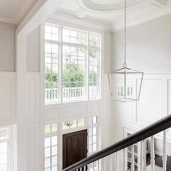 Two Story Foyer Design Ideas Dark Stained Wood Floors, Foyer Paint Colors, White Marble Tile Floor, Trendy Paint Colors, 2 Story Foyer, Timeless Interior Design, White Marble Tiles, Two Story Foyer, Timeless Interior