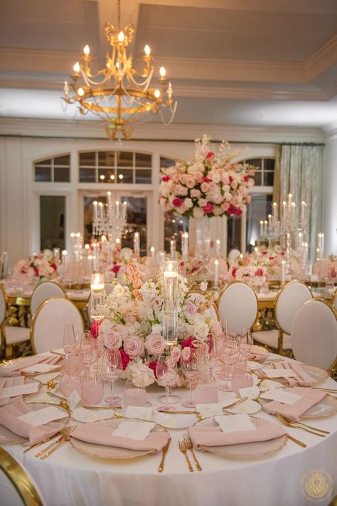 Kristi & Alex’s stunning country club wedding featured pink and white wedding decor. The outdoor ceremony included large pink and white floral arches draping over a mirrored aisle. The wedding reception featured gold and crystal decor with pink & white centerpieces, candelabras and pink glassware. | Floral, Decor, Production, Rentals: Royal Luxury Events / Photo: Jessica Frey Photography | wedding table centerpieces, low floral arrangements, wedding reception decor, pink wedding flowers, elegant Reception Wedding Table Ideas, Blush Pink Wedding Centerpieces Diy, Pink Wedding Venue Decorations, Pink And White Flower Arrangements Wedding, Dark Pink And Gold Wedding, Table Reception Wedding, White Pink And Gold Wedding Decor, Wedding Colors Pink And Gold, Pink And White Engagement Decor