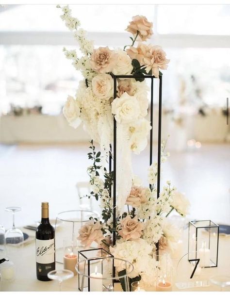 Modern Tall Centerpieces Wedding, Monochromatic Wedding Centerpieces, High Centerpiece Wedding Romantic, Gold Harlow Stand Centerpiece, Champagne Welcome Table Wedding, Elevated Floral Arrangements, Rectangle Wedding Centerpieces, Gala Floral Centerpieces, Neutral Wedding Flowers Centerpieces