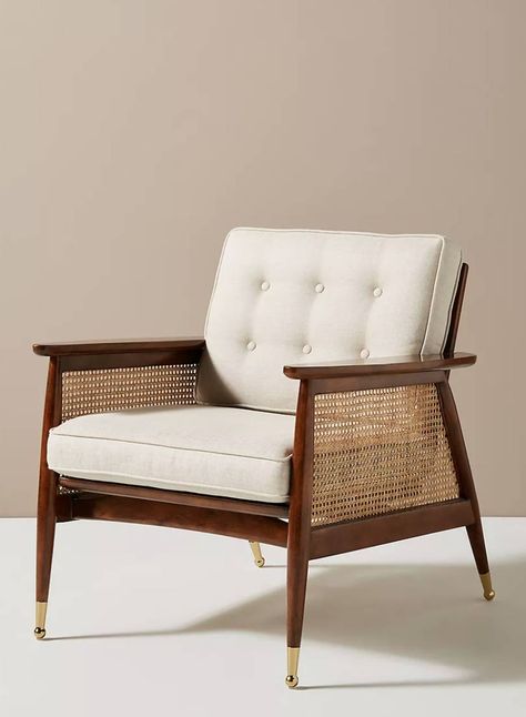 Walnut finish 'Nadia' caned armchair, £698 at Anthropologie. A very elegant chair by Anthropologie with its rich walnut veneer and brass accents, and those caned arms will never go out of style. [button url="https://www.anthropologie.com/en-gb/shop/nadia-caned-accent-chair?color=012&type=REGULAR&size=One%20Size&quantity=1"]Shop now[/button] Cane Webbing Chair, Designer Accent Chairs, Rope Chair, Hanging Furniture, Cane Furniture, Anthropologie Uk, Cane Chair, Furniture Hacks, Room Decorations