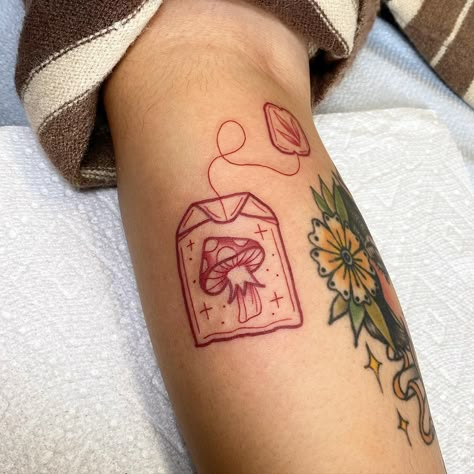 Cute mushroom tea bag #redinktattoo #redtattoo #mushroom #mushrooms🍄 #mushroomtattoo #tattoo #tattooartist #art #tea #teabag… | Instagram Cute Fire Tattoo Ideas, Baker Tattoos Pastry Chef, Mushroom Inspired Tattoos, Red Ink Mushroom Tattoo, Cute Trendy Tattoos, Knee Tattoo Mushroom, Abstract Mushroom Tattoo, Mushroom Cute Tattoo, Minimal Tattoo Designs Unique