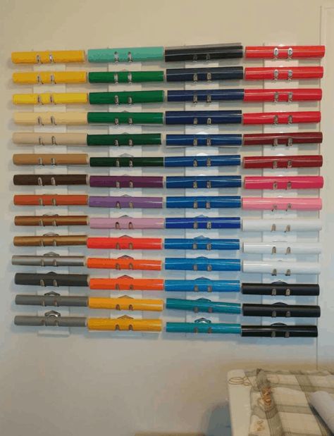 Vinyl Holder Ideas Diy, Vinyl Roll Storage Ideas Diy Wall, Cricut 12x12 Vinyl Storage, Storing Cricut Vinyl Rolls, Diy Vinyl Storage Rack, Diy Vinyl Storage, Storing Vinyl Scraps, Cricut Storage, Adhesive Wall Hooks