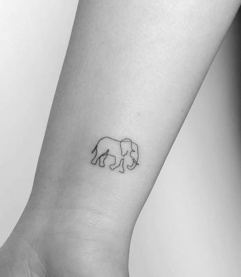 Simple elephant wrist tattoo by @mrs.tattoo Elephant Tattoos Minimal, Blue Elephant Tattoo, Elephant Alzheimer’s Tattoo, Simple Elephant Tattoos For Women, Delicate Elephant Tattoo, Elephant Moon Tattoo, Single Line Elephant Tattoo, Elephants Tattoo Design, 3 Elephants Tattoo