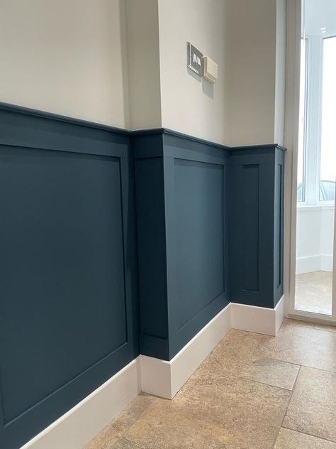 Wainscoting Two Tone, Colourful Wainscoting, Blue Waynes Coating Ideas, Dark Teal Board And Batten, Navy Wainscoting Hallway, Living Room Half Wall Paneling, Coloured Wainscotting, Blue And White Wall Panelling, Dark Panelling Hallway