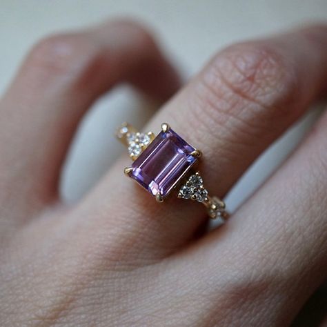 This beautiful Amethyst Versailles Ring features an 8x6mm natural emerald cut amethyst surrounded by sparkly white CZs. Available in your choice of gold vermeil, or 14K solid gold. Create the ultimate stack with our Goddess ring band. Also available in a moissanite version here. Gold vermeil or 14k solid gold Natural 8x6mm emerald cut amethyst Round CZs (what's this?) ** This item is specially made for you. Please allow 1-2 week lead time. ShippingDomestic: Free standard shipping within the U.S. Purple Engagement Rings, Antique Ruby Ring, Purple Stone Ring, Amethyst Wedding Rings, Ruby Ring Vintage, Purple Stone Rings, Amethyst Ring Engagement, Purple Amethyst Ring, Present Birthday