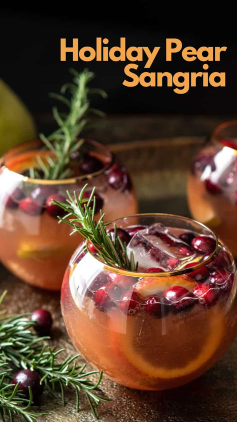 Holiday Pear Sangria Sangria Recipes Christmas, Pear Sangria Recipes, Sangria Recipes Winter, Pear Sangria, Winter Big Batch Cocktails, White Wine Drinks, Winter Sangria Recipes Easy, Christmas Cocktails Big Batch, Holiday Batch Cocktails