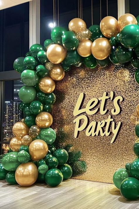 Create an unforgettable party atmosphere with this luxurious green and gold balloon arch, complete with a shimmering "Let’s Party" glitter backdrop. This eye-catching setup is ideal for photo booths, special events, or as a standout decor piece for birthdays, New Year’s parties, or any celebration. Add a touch of glamour and sophistication to your event with this stylish balloon arrangement and sparkling background! Perfect for elevating your party decor to the next level. Balloon Garland Green And Gold, Green And Gold Decorations, St Patricks Day Photo Backdrop Ideas, Emerald Green Backdrop, Emerald Green And Gold Balloon Arch, Green And Gold Balloon Garland For Dessert Table, Dark Green Birthday Theme, Green And Gold Party Decorations, Green And Gold Party