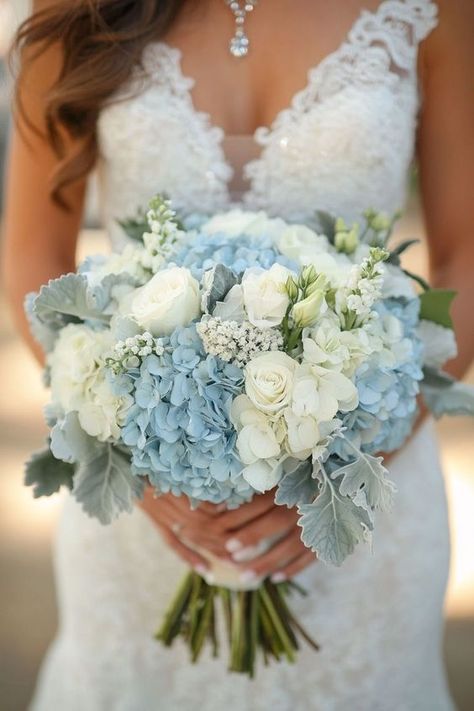 Looking for floral inspiration for your wedding? Hydrangeas bouquets with white, blue, pink, and green flowers offer endless possibilities. These ideas cater to any style, from rustic to elegant, providing a versatile and stunning option for your wedding flowers. Embrace the lush beauty of hydrangeas to add a refreshing and vibrant element to your wedding decor. Bouquet With Blue Hydrangea, Rustic Blue And White Wedding, Wedding Theme Blue And White, White And Blue Hoco Bouquet, Hydrangea And Carnation Bouquet, White Roses And Blue Hydrangeas, Blue White Green Wedding Flowers, Light Blue Hydrangea Bouquet, Wedding Blue Hydrangeas