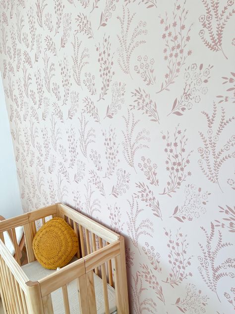 Flower Stencil For Wall, Nursery Wall Stencil Ideas, Pink And White Stencil Wall, Stenciled Nursery Wall, Floral Wall Stencil Patterns, Nursery Accent Wall Wallpaper, Stencil Nursery Wall, Toddler Accent Wall Girl, Baby Girl Accent Wall Nursery