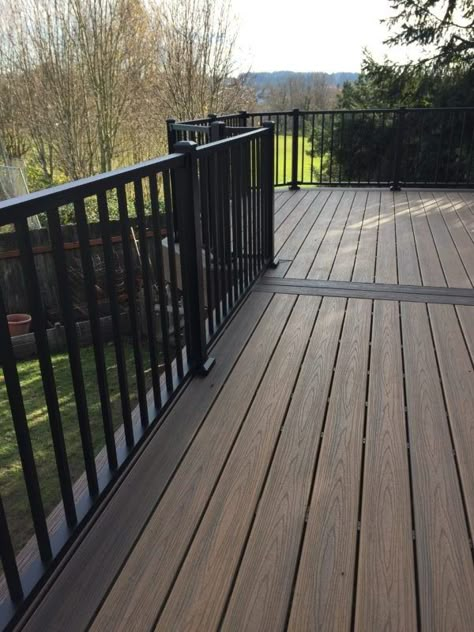 Trek Deck Ideas Front Porch, Brown Trex Deck With Black Railing, Black Trex Deck, Brown Deck With Black Railings, Brown Deck Black Railing, Black Covered Deck, Gray House Brown Deck, Deck Colors For Brown House, Black Deck Railing Color Combos