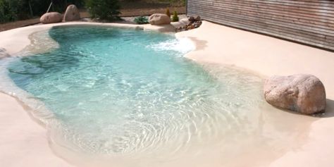 Instead of installing traditional pools for some backyard fun in the sun, people are creating their own sandy beaches! Sand Pool Ideas, Sand Pools Backyard, Beach Entrance Pool Designs, Pool Beach Ideas, Faux Beach Backyard, Diy Beach Backyard, Small Beach Entry Pool, Beach Pools Backyard, Beach Entrance Pool