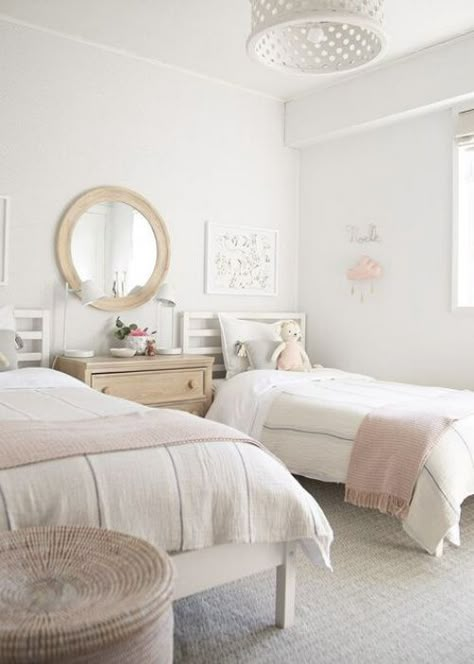 Are you looking to design a shared bedroom for your darling girls? We've rounded up the prettiest shared girls rooms for you. 2 Bed 1 Room Ideas, White Twin Bed Girls Room, White Childrens Bedroom, 2 Beds Girls Room, 2 Twins In One Room, Kids Room Two Twin Beds, Room Ideas For Two Beds, Two Beds Room Ideas, White Twin Bedroom Ideas