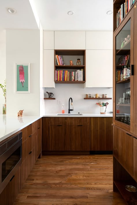 Mid Century Modern Kitchen Small Apartment, Dark Wood Mid Century Kitchen, Dark Wood Floors Light Wood Cabinets, Mid Century Modern Kitchen Black, Walnut Cabinets White Countertops, 70s Modern House, Walnut Kitchen Cabinets Color Schemes, Walnut Cabinets Kitchen, Midcentury Modern Living Room Decor