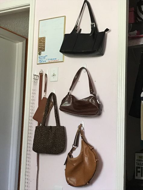 Handbags On The Wall, Purse Wall Aesthetic, Hang Bags In Room, Ways To Hang Purses On Wall, Hanging Handbags On Wall, Purses Hanging On Wall, Purse On Wall, Purse Wall Display Bedroom, Hanging Purses On Wall