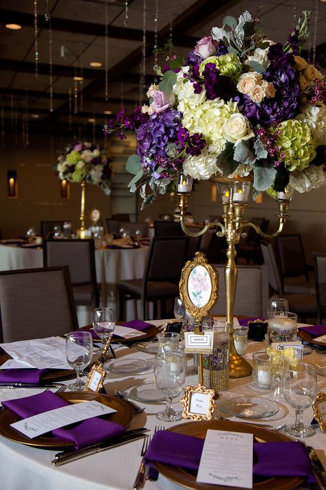 Lilac And Gold Decor, Tall Purple Wedding Centerpieces, Purple And Green Reception Decor, Wedding Decor Purple And White, Royal Wedding Aesthetic Decor, Dark Purple And Gold Quinceanera Theme, Purple Gold Decor, Purple Gold And White Table Decorations, Purple And Gold Flower Arrangements