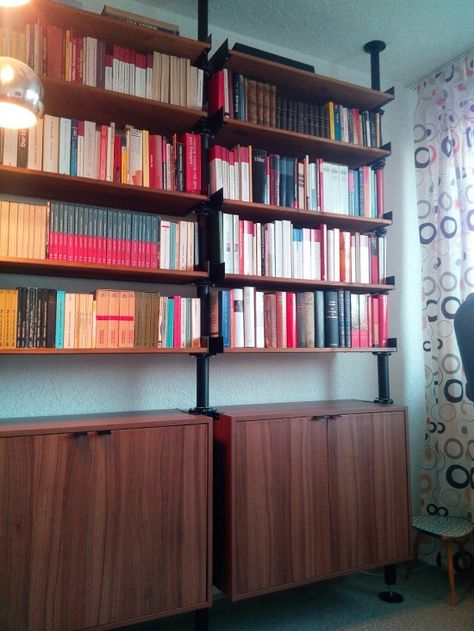 Ikea hack using stolmen pipes, brackets and kitchen cabinets for classic look Ikea Ivar Bookshelves, Ikea Ivar Shelves Living Room, Ikea Bookcase Hack Pipe Legs, Ivar Ikea Books, Home Library Ikea, Ikea Ivar Shelves Stained, Library Ikea, Ideas For Home Library, Stolmen Ikea