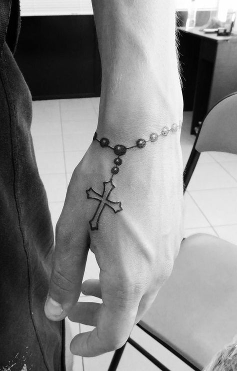 Unique Men’s Wrist Tattoos: Ideas for Personal Style and Expression Cr7 Tattoo, Cross Tattoo On Hand, Tattoo Ideas Males, Simple Wrist Tattoos, Unique Wrist Tattoos, Simple Tattoos For Guys, Cool Wrist Tattoos, Cross Tattoo For Men, Wrist Tattoos For Guys