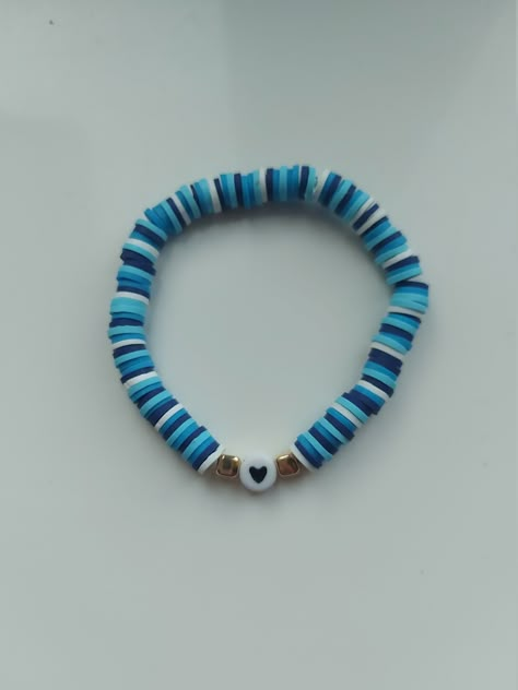 Fun coloured blue heart bracelet! This handmade bracelet is stretchable so it will fit most adults and children's wrist. This bracelet is made out of clay beads that doesn't nip or rip your skin when you wear them.  They are so comfortable! If you have any questions please contact me below. Clay Bracelet Ideas Blue, Clay Bead Bracelet Blue, Braclets Ideas Clay Beads Easy, Blue Clay Bead Bracelets, Teddy Bear Activities, Clay Beads Bracelet Ideas, Beads Bracelet Ideas, Bear Activities, Clay Beads Bracelet