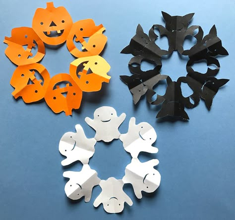 Step-by-step tutorial with photos showing how to fold & cut out Halloween paper snowflakes - Ghost, Bat, and Pumpkin designs! Made with origami paper and cut out using scissors and a hole punch.   #halloween #halloweencraft #halloweendecorations #halloweendecor #ghost #bat #pumpkin #papersnowflake #snowflake #artproject Halloween Pumpkin Paper Crafts, Halloween Paper Snowflakes, Paper Craft Halloween, Diy Halloween Paper Decorations, Paper Craft Room Decor, Origami Ghost Step By Step, Halloween Paper Pumpkin, Paper Halloween Decorations Diy, Halloween Origami Step By Step