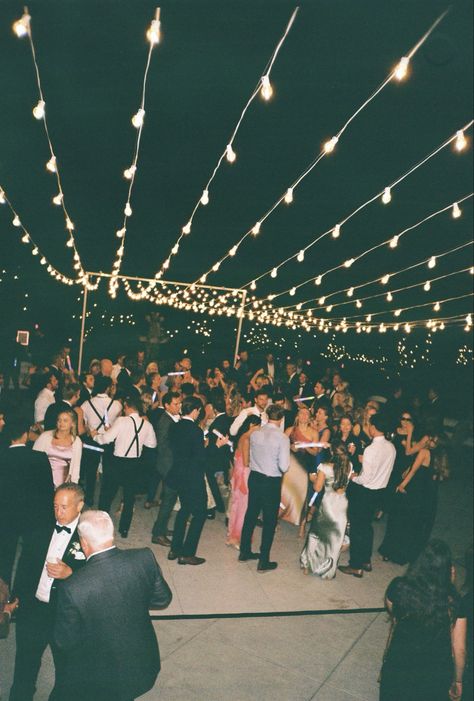 Wedding dance floors adorned with string lights create a magical and inviting atmosphere, perfect for celebrating under a soft, romantic glow. The twinkling lights suspended overhead add a whimsical touch, making the space feel intimate and enchanting. Combined with the lively energy of the dance floor, this setup brings warmth and elegance to any wedding reception. #WeddingDanceFloor #StringLightsMagic #RomanticWeddingVibes #EnchantedReception #WhimsicalWeddings #DanceUnderTheLights #MagicalWeddingNights #WeddingDecorGoals #TwinklingLights #ElegantWeddings Twinkle Lights Over Dance Floor, Outdoor Dancefloor, Wedding Dance Floors, Wedding Reception Dance Floor, Dancing Wedding, Wedding Dance Floor, Wedding Reception Lighting, Rain Wedding, Clear Tent