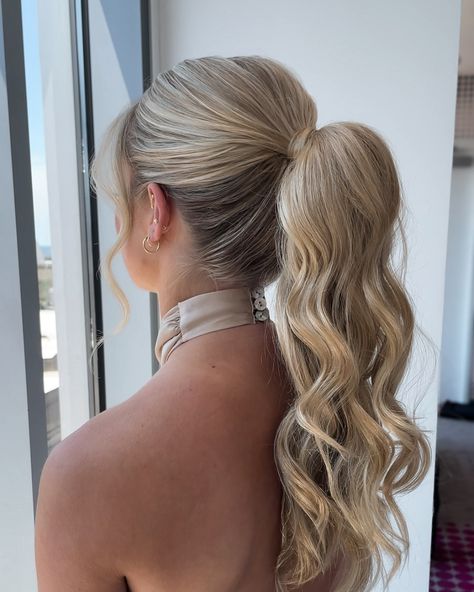 The ponytail is never not a good idea in my opinion 🤷🏼‍♀️⁣ ⁣ Loved that we kept this ponytail simple with some soft textured waves.⁣ ⁣ Her high neck dress, the ponytail - it was a moment🤌🏻⁣ ⁣ The perfect style for a bridesmaid - swipe to see the front because she is gorgeous and SAVE for your bridesmaid hair inspo! High Pony For Bridesmaid, Hoco Hair Styles Ponytail, Formal Hair Low Ponytail, Long Hair Formal Ponytail, Cute Homecoming Ponytails, Teased Ponytail Bridesmaid, Braid Into Ponytail Homecoming, Formal Updos Ponytail, Homecoming Hairstyles Low Ponytail