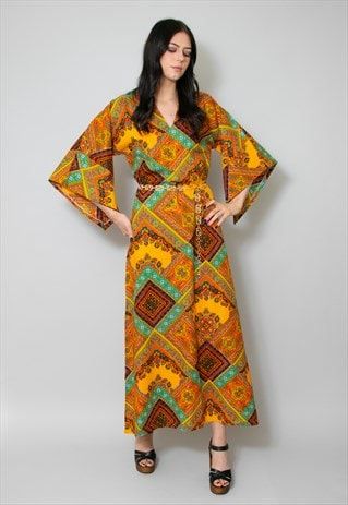 Approximate measurements in inches: Bust:20 Length:55 Pit to cuff:11 Ladies vintage 70's kaftan maxi dress. Yellow based with a multi print.Kimono sleeves, we have added a belt (not more... Approximate measurements in inches: Bust:20 Length:55 Pit to cuff:11 Ladies vintage 70's kaftan maxi dress. Yellow based with a multi print.Kimono sleeves, we have added a belt (not included) so kaftan can be worn loose or cinched in. A cotton fabric. If the sizing is mentioned with original sizing and labels please be aware this is vintage sizing so please check our measurements. Measurements are taken with the item laid flat and across. Model is 5ft 9 and a UK size 6-8. Some garments may have been pinned to the model but not all. We would love to see your vintage looks, please tag us in your posts to