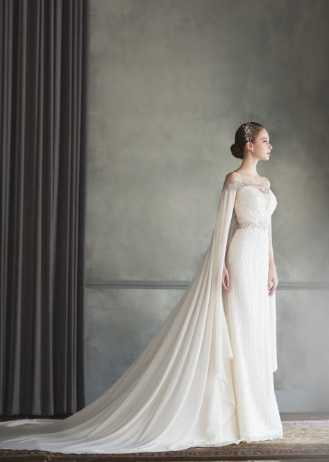 How beautiful is this Bonheur Sposa gown featuring an unique off-the-shoulder jeweled neckline and a stylish cape! Gaun Koktail, Cape Wedding Dress, Trendy Wedding Dresses, White Wedding Dress, Cape Dress, A Wedding Dress, Dress Robes, Wedding Dress Inspiration, Wedding Dress Ideas