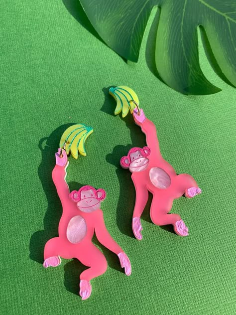 Fun is the currency 🐒📈🍌✨ ✦ Lightweight, acrylic laser-cut earrings finished with 18k gold plated stainless steel posts, making them safe for most ears. ✦ Measures approximately 3.3 x 1.25". ✦ Handmade with love in Louisville, KY. Cute Animal Earrings, Wacky Earrings, Crazy Accessories, Laser Cut Earrings Acrylics, Novelty Accessories, Silly Earrings, Laser Acrylic, Tropical Accessories, Quirky Accessories