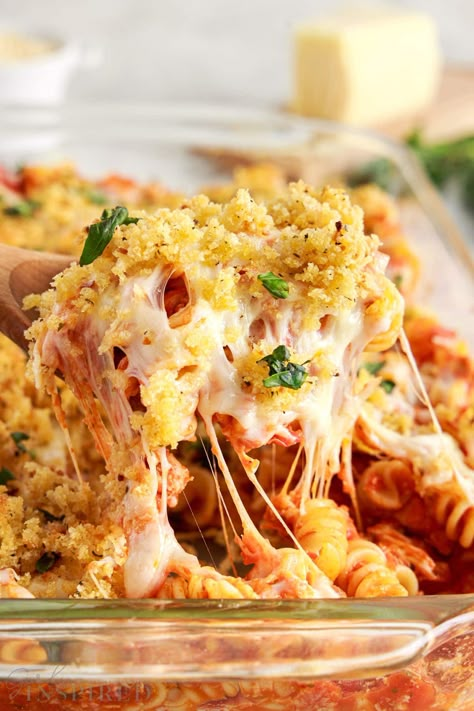 Enjoy this chicken parmesan pasta bake in a casserole dish that is ready in just 35 minutes, but has the same great traditional flavors. It's cheesy, filling, and topped with toasty breadcrumbs. Easy Chicken Parmesan Casserole With Pasta, Chicken Parmesan Casserole 12 Tomatoes, Pasta Bake With Breadcrumbs, Park Chicken Casserole, Chicken Parm Noodles, Popcorn Chicken Parmesan Casserole, Baked Chicken Parmesan Pasta, Baked Chicken Parm Casserole, Chicken Parmesan Casserole Instant Pot