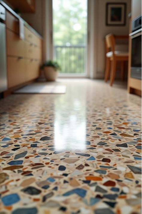 Close-up of colorful terrazzo kitchen flooring Terrazo Tiles Kitchen Floor, Terazzo Floor Kitchen Ideas, Concrete Kitchen Floors Ideas, Terrazzo Mudroom Floor, Kitchen Floor Design, Tile Transitions Between Rooms, Terrazo Kitchen Flooring, Terrazzo Floor Tiles Living Room, Terrazzo Kitchen Backsplash