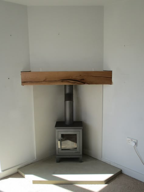 Stove Fireplace Ideas Corner, Wood Stove In Living Room Corner, Wood Stove Set In Fireplace, Wood Burner In Kitchen, Snug With Log Burner, Wood Stove Fireplace Corner, Tv Over Wood Burning Stove, Corner Stove Fireplace Ideas, Wood Stove Corner