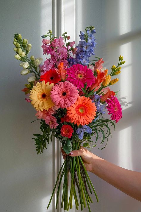 A gerbera bridal bouquet with pink, orange, and yellow blooms. Colorful Daisy Bouquet, Bridesmaids Colorful Bouquets, Rainbow Flowers Wedding, Multicolored Flowers Wedding, Wedding Bouquets Bright Colors, Bouquet Of Flowers Colorful, Pink Orange Blue Wedding Flowers, Mexican Bouquet Of Flowers, Bright Wildflower Wedding Bouquet