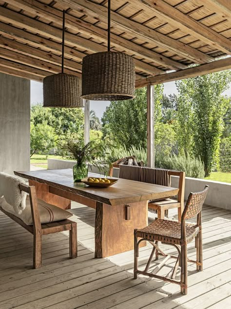 A rustic yet modern veranda in a vacation home in Uruguay.