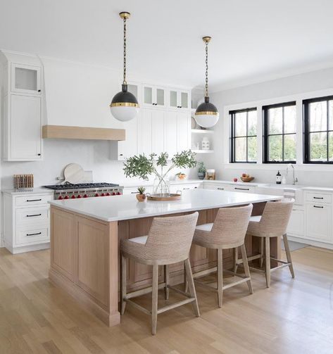 Well-appointed white kitchen features a beige island lit by 2 Hicks pendants hung over a white quartz countertop seating beige woven stools. Shaker Style Kitchen Island, Kitchen Island Seating Ideas, Melanie Turner Interiors, Shiplap Kitchen, Beach Style Kitchen, Kitchen Island Tops, Grey Kitchen Island, White Kitchen Ideas, White Kitchen Island