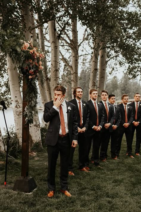 Fall Groomsmen Ideas, Black Tux With Copper Tie, Groom Attire Terracotta, Dark Grey Suit Fall Wedding, Terracotta And Copper Wedding, Black And Terracotta Groomsmen, Cinnamon And Eucalyptus Wedding, October Wedding Groomsmen, Black And Brown Suit Wedding