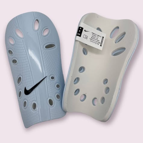 Discover The Ultimate Protection With Our Nike J Guard Small Unisex Adult Shin Guards, Expertly Crafted For Both Football And Soccer Enthusiasts. These Shin Guards Combine Functionality And Comfort, Making Them A Must-Have For Any Serious Player. Made With A Highly Protective Hard Front Plate And 95% Polypropylene, They Offer Unmatched Durability And Safety On The Field. The 5% Thermoplastic Gum Material, Injection-Molded For Precision, Ensures A Snug, Secure Fit While Providing Flexibility For Soccer Must Haves, Soccer Things, Soccer Stuff, Soccer Protective Gear, Black Nike Sweatpants, Shin Guards Soccer, Nike Tech Fleece Hoodie, Soccer Essentials, Soccer Bag