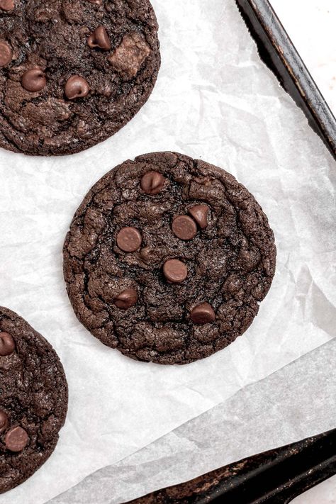 Indulge in these deliciously rich and decadent double chocolate chip cookies. These cookies are made without eggs so they're perfect for anyone with dietary restrictions too! These cookies are packed with gooey chocolate chips and lots of cocoa powder. Get the recipe here! Eggless Double Chocolate Chip Cookies, Chocolate Chip Cookies Egg Free, Chocolate Chip Cookies No Eggs Recipes, Eggless Christmas Cookies Recipes, Baked Goods Without Eggs, Eggless Baked Goods, Chocolate Chip Cookies Recipe No Egg, Chocolate Cookies Eggless, Chocolate Cookies Without Eggs