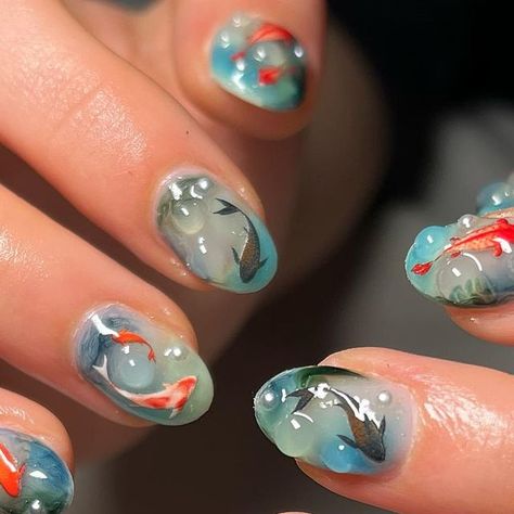 J3N NAILED IT on Instagram: "💧 underwater fish nails for lovely @greta.chaparro 💧 happy birthday!!⭐️🫶🏼🎀 FREESTYLE Builder gel Blossom gel Gosh stickers Pearls 3D gel #ifitwasntj3ndothemagain DM 2 BOOK #londonnails #fulhamnails #nailsoftheday #fish #fishnails #koifish #koifishnails #seanails #swampnails #fishnailart #waternails #bluenails #seanails #aquarium #aquariumnails #fyp #explorepage #safespace #popular #bluenails #greennails #almondnails #birthdaynails #celebnails #bluenails" Nail Fish Design, Coy Fish Nail Art, Chinese Blue Nails, Nails Fish Design, Fishbowl Nails, Goldfish Nail Art, Underwater Nail Art, Fish Tank Nails, Koi Fish Nail Design