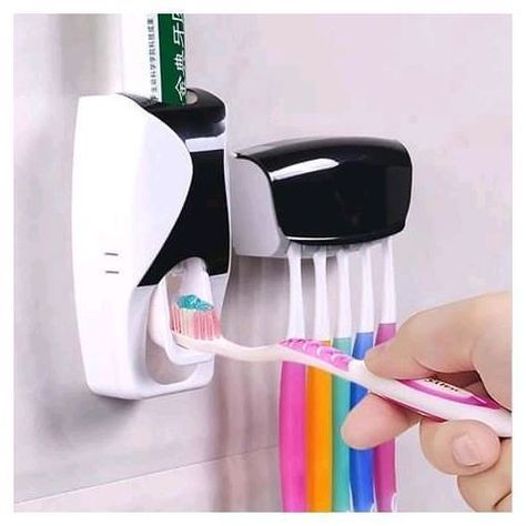 It a picture of a toothpaste dispenser and brush holder Dekorasi Halloween, Wall Mounted Toothbrush Holder, Toothbrush And Toothpaste Holder, Sikat Gigi, Space Saving Bathroom, Toothpaste Squeezer, Toothbrush Storage, Toothpaste Holder, Bathroom Gadgets