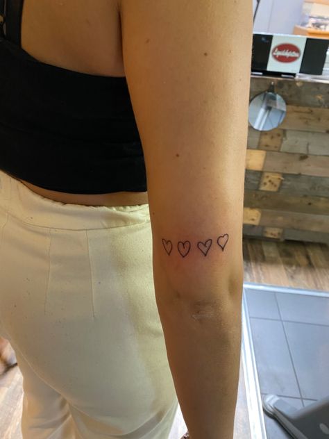 Family Tattoos 3 People, Tattoos From Family Members, Mini Family Tattoo, Heart Tattoo On Back Of Arm, Hearts By Family Tattoo, Four Small Hearts Tattoo, Hearts From Family Tattoo, Cute Tattoos For Family, Row Of Hearts Tattoo