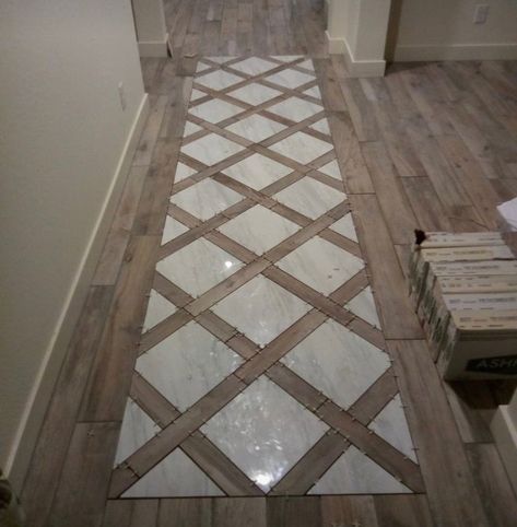 Tile That Looks Like A Rug, Accent Floor Tile Bathroom, Tile By Front Door Entry Ways, Closet Tile Flooring, Open Floor Living Room Ideas, Travertine And Wood Floors, Cobblestone Flooring Interior, Tile Inlay Wood Floor Entryway, French Country Flooring Ideas