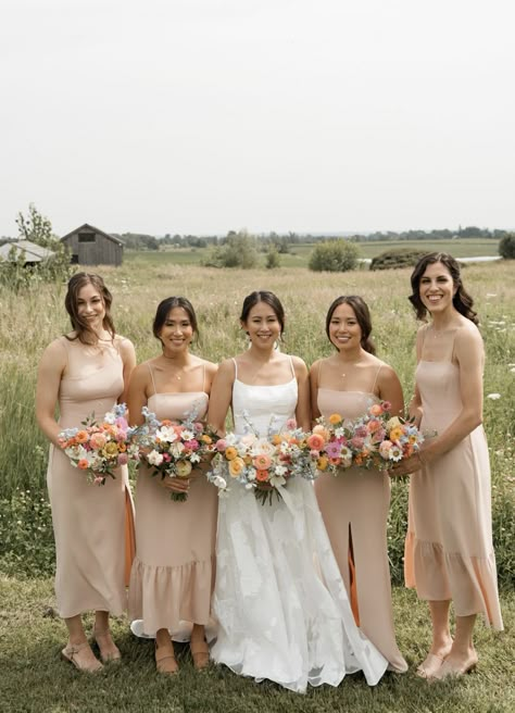 Champagne Bridesmaid Dresses With Bright Florals, Garden Party Wedding Bridesmaid Dress, Wildflower Bridesmaid Bouquet, Wildflower Wedding Bridesmaids, Neutral Bridesmaid Dresses Mismatched, Tan Bridesmaid Dresses, Bridal Party Color Schemes, Bouquet Styles, 2026 Wedding