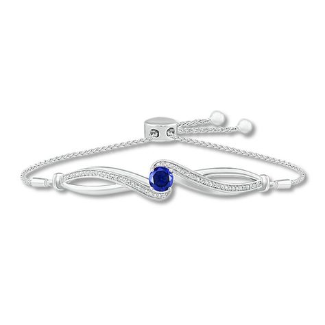 Sweet and on-trend chic, this shimmering bolo bracelet is a must-have accessory. The infinity-inspired center features a brilliant round-cut blue lab-created sapphire amidst sweeps of glittering white lab-created sapphires. Styled in sterling silver, the adjustable wheat chain secures with a bolo clasp. Disney Treasures, Bolo Bracelet, White Lab, Rose Ring, Bracelet Sterling Silver, Black Onyx, Sterling Silver Bracelets, Round Cut, Wheat