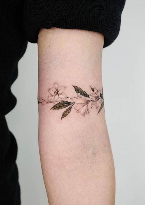 Wrap Around Tattoos For Women Arm, Lily Arm Band Tattoo, Floral Arm Band Tattoo For Women, Minimal Arm Tattoos For Women, Arm Cuff Tattoo For Women, Upper Arm Wrap Tattoos For Women, Armband Tattoo For Women, Wrap Around Tattoos, Flower Band Tattoo