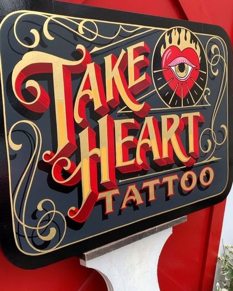 Best Dressed Signs on Instagram: "Projecting sign and window combo for @take.heart.tattoo.  Thanks to Lauren for having us come paint your shop, you guys rule!!! ❤️🤘   #tattooshop #handpainted #letteringart #signpainting #bostonsignpainter #tattoosketch #signwriting #tattoodesign #takehearttattoo" Tattoo Signs Shop, Hand Painted Tattoo Sign, Sign Painter Font, Sign Painter Lettering, Tattoo Studio Interior, Circus Signs, Painting Lettering, Sign Lettering, Sign Painting Lettering