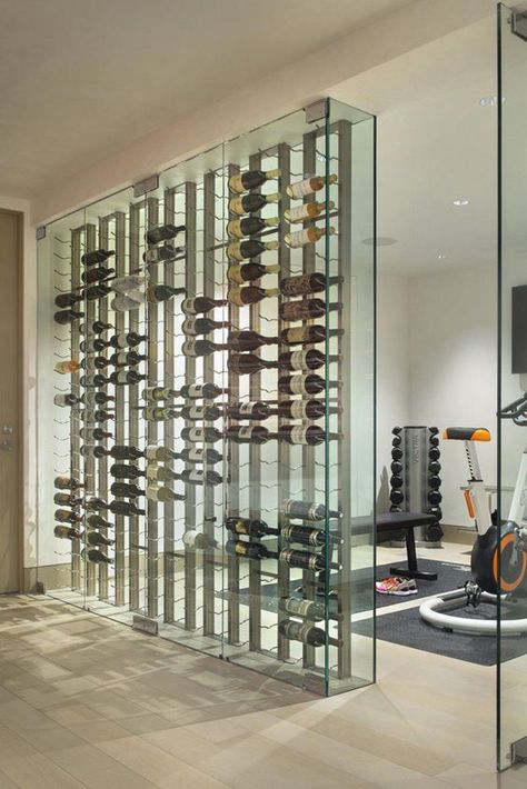 modern-home-gym-with-wine-cellar-dividers Wine Cellar Wall, Modern Wine Rack, Wine Cellar Ideas, Glass Wine Cellar, Cellar Ideas, Wine Closet, Wine Rooms, Home Wine Cellars, Living Room Light Fixtures