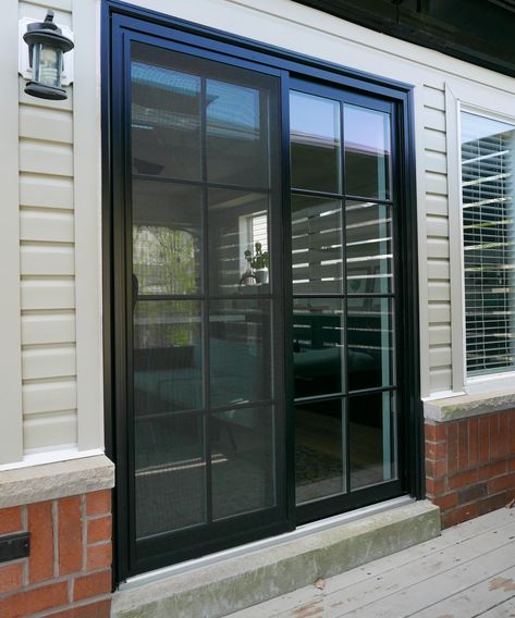 Level up up your backyard with a black double sliding patio door with SDL grilles. Let us help you with your next backyard project. Contact us today for all your patio door needs and questions. Black Sliding Doors Exterior, Black Sliding Doors Patio, Black Patio Doors, Black Sliding Doors, Double Sliding Patio Doors, Exterior Sliding Glass Doors, Backyard Door, Black Sliding Door, Pintu Ganda